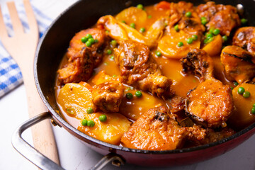 Chicken with potatoes and vegetables. Traditional tapa spanish recipe.