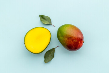 Layout of mango and leaves. Tropical fruits background