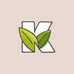 K letter logo hand drawn with a felt-tip pen in soft colors.