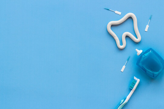 Toothbrush with tube of toothpaste and dental floss. Oral care and dental hygiene