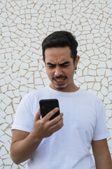 Fototapeta premium Boy in white shirt expressing emotions