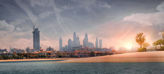 Dubai Marina skyscrapers and villas on the Palm Jumeirah. Luxury properties of UAE