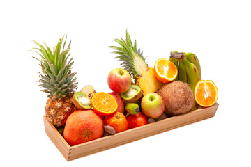 Naklejka na ściany i meble Healthy eating. Set of fresh tropical fruits in a wooden tray. On a white isolated background.