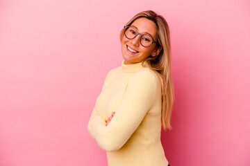 Young mixed race woman isolated on pink background happy, smiling and cheerful.