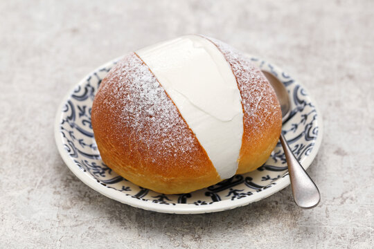 homemade Maritozzo is italian roman breakfast sweet that whipped cream sandwiched between brioche.