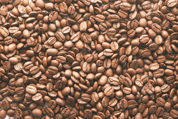 top view of fresh coffee beans on black background 