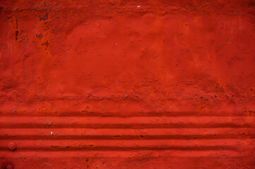 background metal surface with red paint