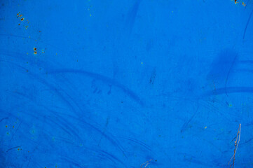 background metal surface with burnt out blue paint