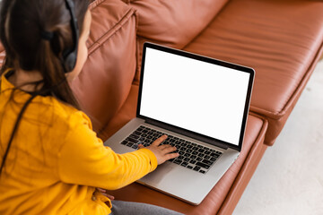 Distance Learning. Mockup Image Of Little Girl Using Laptop With Blank Screen At Home, Studying...