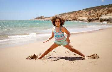 Girl is engaged in sports on the coast.