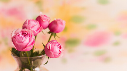 Spring flower arrangement of fresh roses on a light pastel background. Festive floral concept with copy space