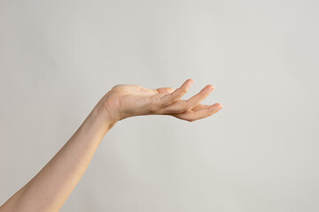 Hand gestures. Elegant female hand, pointing to the side