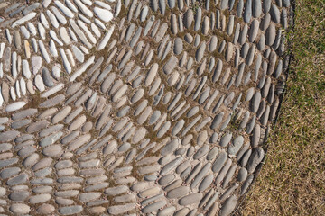 Stone pavement. Pieces of granite on the road. The road is made of stone.