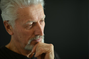 Fototapeta premium Portrait of sad thinking senior man