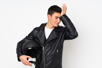 Man holding a motorcycle helmet isolated on white background having doubts with confuse face expression