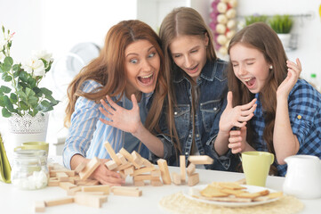 Happy family playing with blocks together