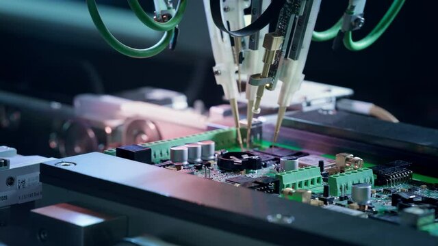 Electronic circuit boards production and installation of SMD components. Needle automatic equipment diagnose and test chips and processors. Manufacture of electronic chips. High-tech, close-up