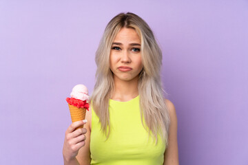 Obraz premium Teenager girl over isolated purple background with sad expression