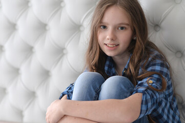 Portrait of cute girl sitting on the floor