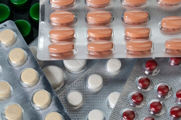 Different pills, tablet's blisters and capsules background. Pharmacalogical concept