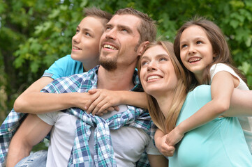 Portrait of happy young family in summer  park