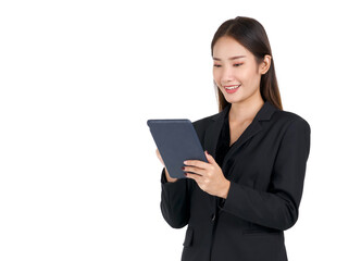 Young asian businesswoman with a smile in a black suit typing on a tablet computer. Portrait on white background with studio light.