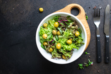 salad olives leaves green petals lettuce mix fresh healthy appetizer trend diet meal snack copy space food background rustic. top view keto or paleo diet vegan or vegetarian food