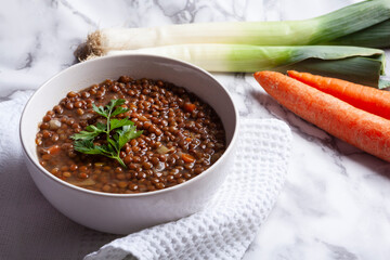 bowl of lentils with carrot and leek