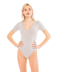 Portrait of a young blonde woman in gray bodysuit