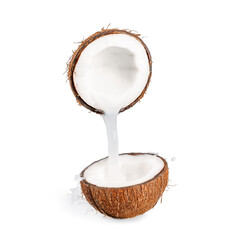 Coconut milk flows from one half of the coconut to the other with splashes on a white background.