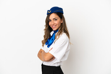 Airplane stewardess over isolated white background with arms crossed and looking forward