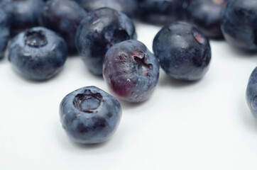 Closeup on fresh and ripe blueberries on a white background