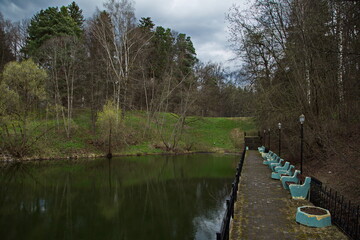 Manor park pond on a cloudy spring day.