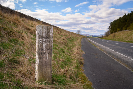 Milestone north near Otterburn on A696, where there are several ancient marker posts on the rural A696 road in Northumberland