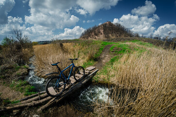 Mountain bike on the background of a spring landscape, spring bike ride