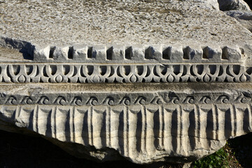 Fototapeta na wymiar Greek craftsmanship engraved on White marble, Greek scripts on White stone in Izmir, Turkey.