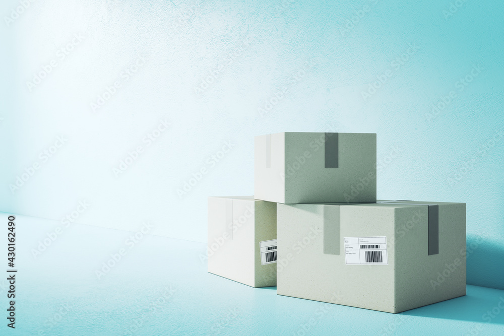 Poster Courier service and delivery concept with three cardboard boxes with barcode in empty room on blank blue wall background. 3D rendering, mock up