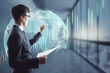 Financial market analysis concept with trader writing on digital screen with world map and growing financial chart