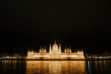 Fototapeta na wymiar Panoramic view of the Parliament building in beautiful night lighting in Budapest