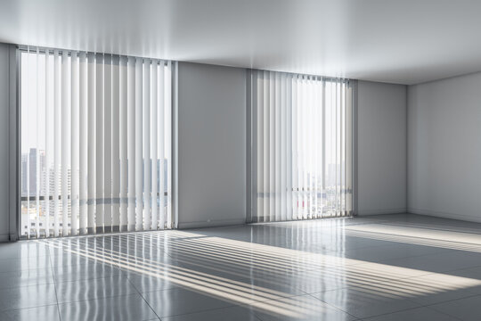 Light empty room with sunlight through blinds on windows and glossy floor