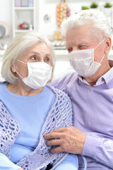 Portrait of sick  elderly woman and man  with facial masks