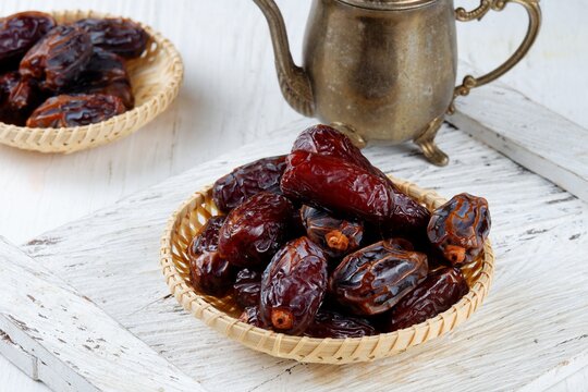 medjool date in plate isolated white background