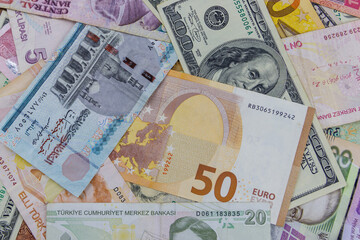Fototapeta na wymiar Multicurrency background of US dollars, euros, Turkish liras, Egyptian pounds and Ukrainian hryvnias