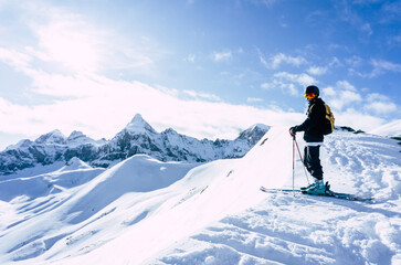 Naklejka na ściany i meble skier on the top of mountain with a beautiful views