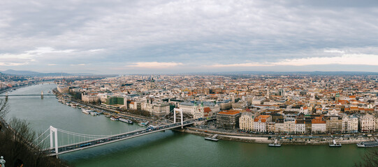 Panorama of beautiful buildings and Elizabeth Bridge over the Danube