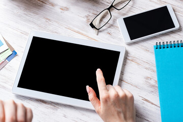Business lady using tablet computer at desk