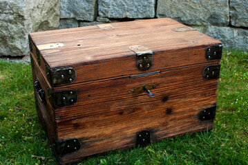 Old retro vintage wooden chest on house garden closeup