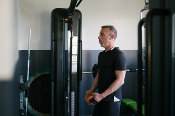 Fototapeta na wymiar Concept: sport. Athlete man in the gym. Concentrating before training.