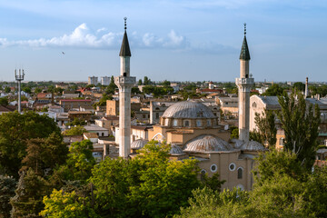 Fototapeta na wymiar minaret of Juma-Jami Mosque in City of Yevpatoria on the Peninsula Crimea