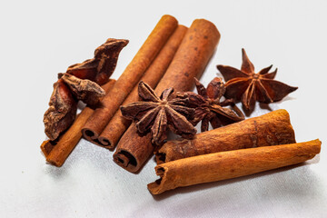 Star anise (Illicium verum) and cinnamon sticks (Canehl) close-up isolated on a light background